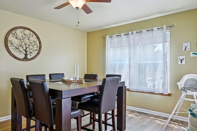 1043 San Mateo Dr, Romeoville, IL 60446 - dining space featuring ceiling fan, baseboards, and wood finished floors