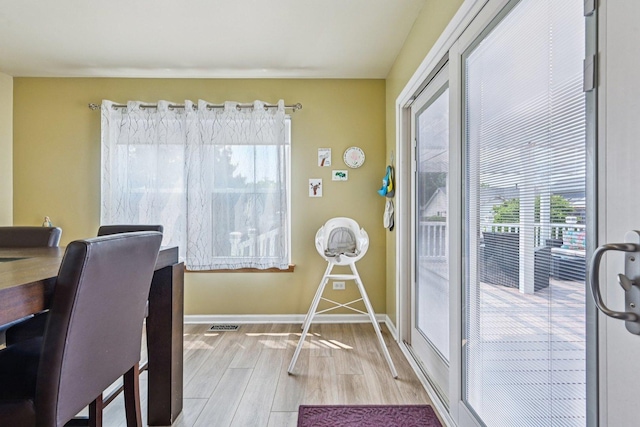 1043 San Mateo Dr, Romeoville, IL 60446 - dining room with light wood-style floors, plenty of natural light, and baseboards