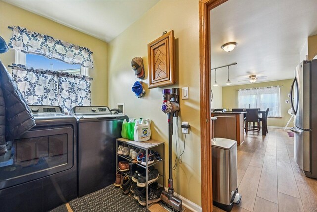 1043 San Mateo Dr, Romeoville, IL 60446 - washroom featuring washing machine and clothes dryer, wood finished floors, a ceiling fan, and baseboards