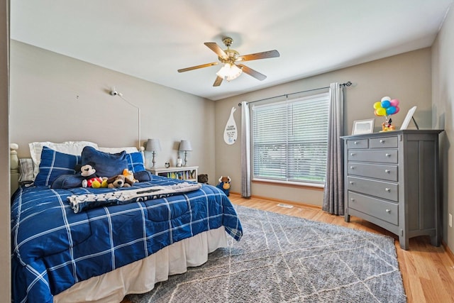 1043 San Mateo Dr, Romeoville, IL 60446 - bedroom with wood finished floors and ceiling fan