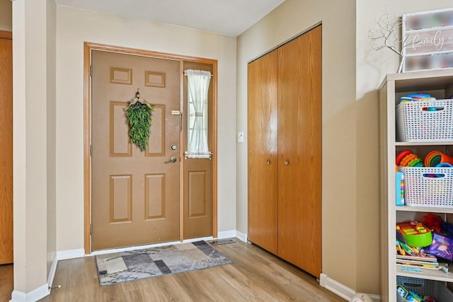 1043 San Mateo Dr, Romeoville, IL 60446 - foyer entrance with light wood finished floors and baseboards