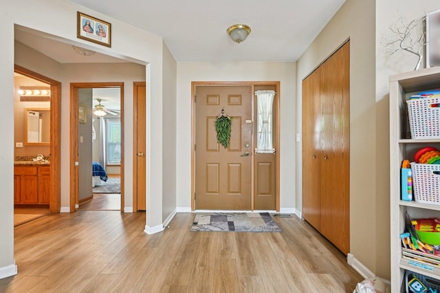 1043 San Mateo Dr, Romeoville, IL 60446 - foyer with light wood-style flooring, baseboards, and a ceiling fan
