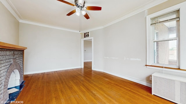 4608 W Altgeld St, Chicago, IL 60639 - unfurnished living room with radiator, plenty of natural light, ornamental molding, a ceiling fan, and wood finished floors