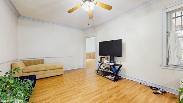 4608 W Altgeld St, Chicago, IL 60639 - living room with ornamental molding, wood finished floors, a ceiling fan, and baseboards