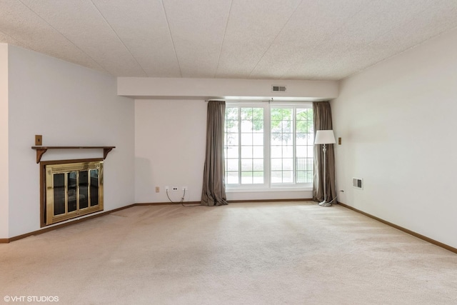 1258 Chalet Rd Unit 101, Naperville, IL 60563 - unfurnished living room with carpet flooring and a glass covered fireplace