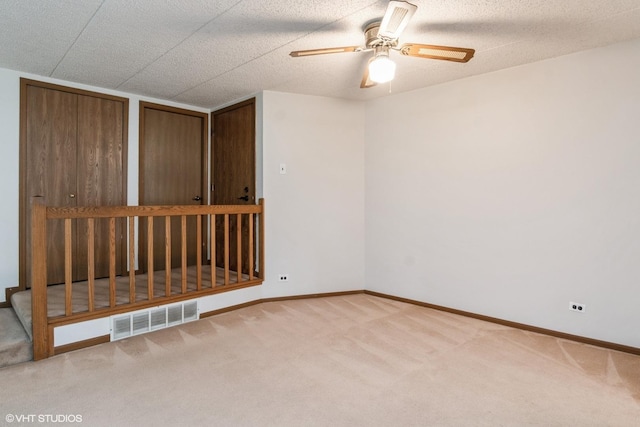 1258 Chalet Rd Unit 101, Naperville, IL 60563 - carpeted empty room with ceiling fan and baseboards