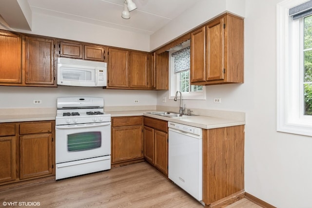 1258 Chalet Rd Unit 101, Naperville, IL 60563 - kitchen featuring white appliances, brown cabinets, and light countertops