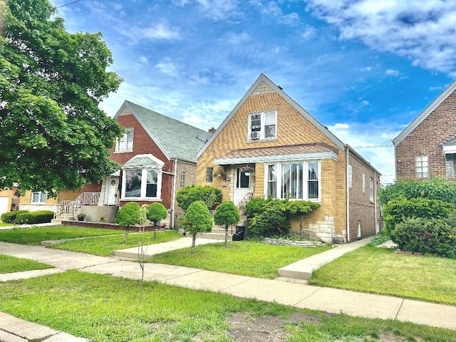 5930 W School St, Chicago, IL 60634 - english style home with a front yard and brick siding