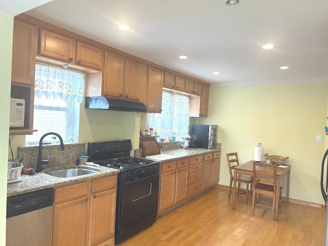 5930 W School St, Chicago, IL 60634 - kitchen featuring gas stove, stainless steel dishwasher, a sink, light wood-style floors, and under cabinet range hood