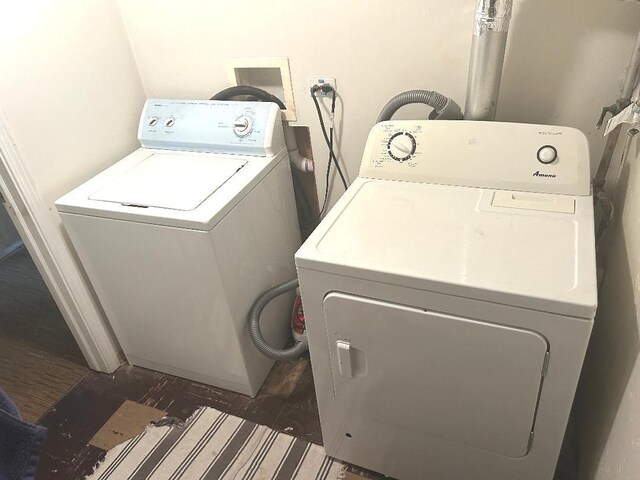 5930 W School St, Chicago, IL 60634 - washroom featuring washer and dryer and wood finished floors