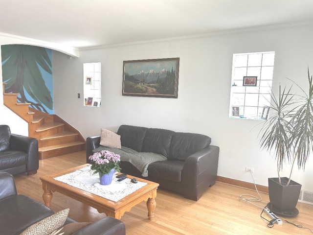5930 W School St, Chicago, IL 60634 - living room with stairway, crown molding, light wood-style flooring, and baseboards