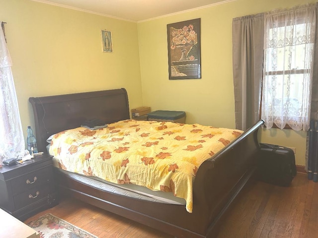 5930 W School St, Chicago, IL 60634 - bedroom featuring wood finished floors and ornamental molding