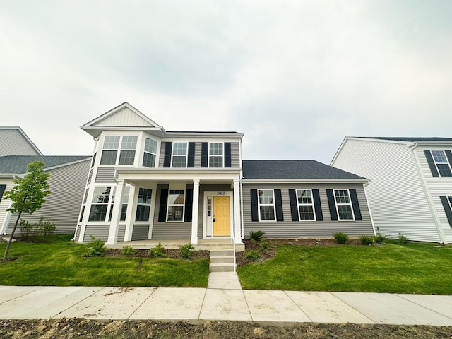 993 Celebration Dr, Aurora, IL 60504 - view of front of house with a porch and a front yard