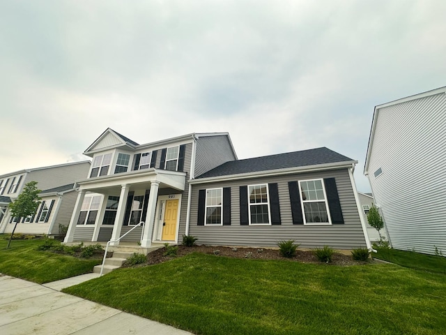 993 Celebration Dr, Aurora, IL 60504 - view of front facade featuring a front yard and covered porch