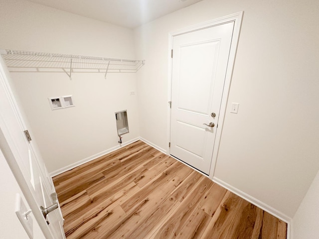 993 Celebration Dr, Aurora, IL 60504 - laundry area featuring washer hookup, light wood-style floors, and baseboards