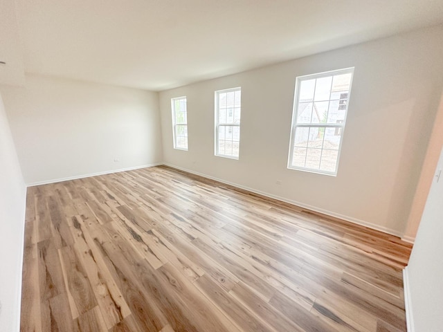 993 Celebration Dr, Aurora, IL 60504 - spare room featuring light wood-style floors and baseboards
