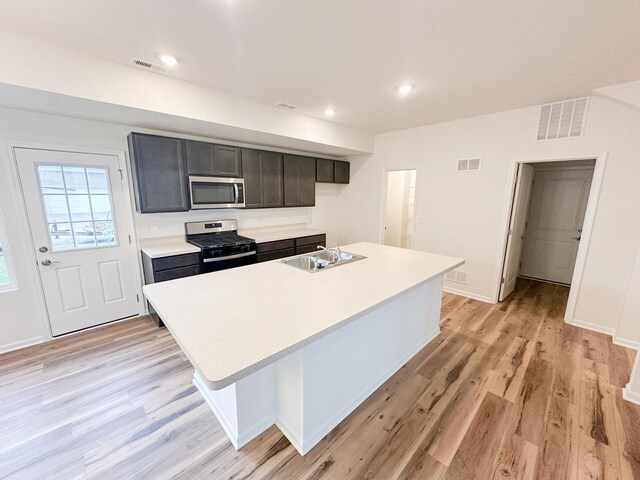 993 Celebration Dr, Aurora, IL 60504 - kitchen featuring black gas stove, stainless steel microwave, a sink, light countertops, and recessed lighting