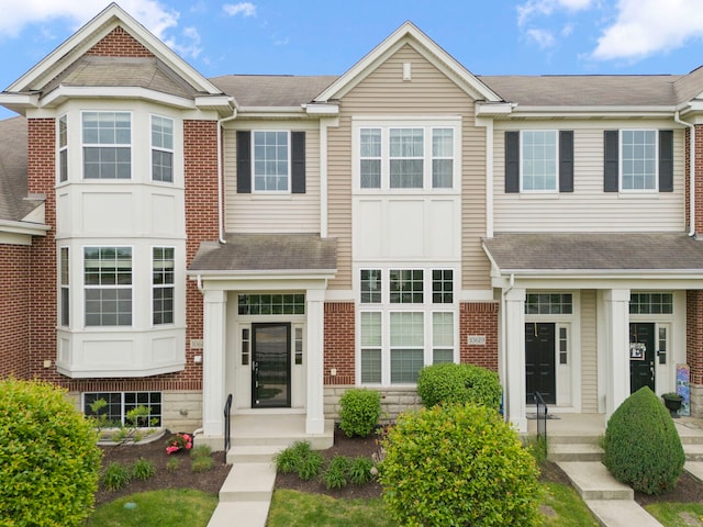 10615 W 153rd St, Orland Park, IL 60462 - townhome / multi-family property featuring roof with shingles and brick siding