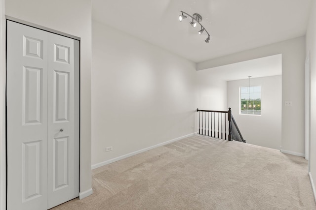 10615 W 153rd St, Orland Park, IL 60462 - empty room with carpet, baseboards, and rail lighting
