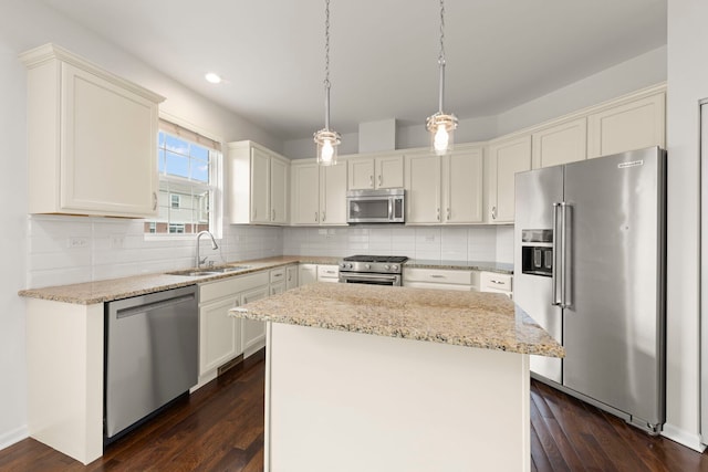 10615 W 153rd St, Orland Park, IL 60462 - kitchen featuring premium appliances, a sink, recessed lighting, light stone countertops, and a kitchen island
