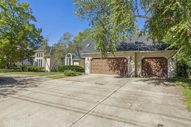 3010 35th St, Oak Brook, IL 60523 - view of front of house featuring an attached garage and concrete driveway