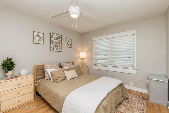 490 W Crystal Lake Ave, Crystal Lake, IL 60014 - bedroom with light wood-style flooring, baseboards, and a ceiling fan