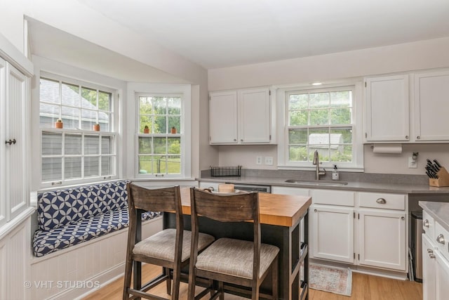 490 W Crystal Lake Ave, Crystal Lake, IL 60014 - kitchen featuring a sink, white cabinets, and light wood-style floors