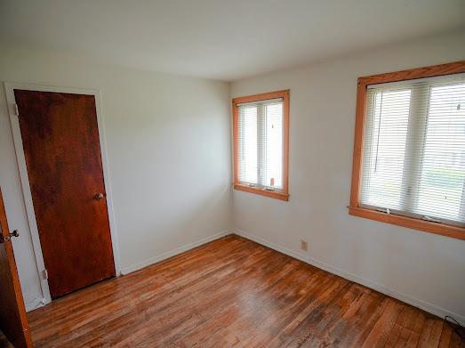 64 Ash St, Park Forest, IL 60466 - empty room with wood finished floors and baseboards