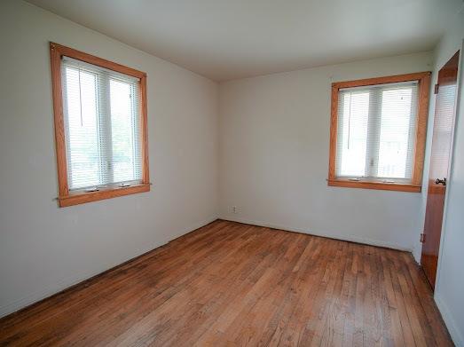 64 Ash St, Park Forest, IL 60466 - unfurnished room with healthy amount of natural light and wood finished floors