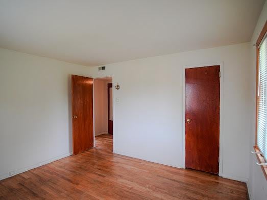 64 Ash St, Park Forest, IL 60466 - spare room featuring wood finished floors and plenty of natural light