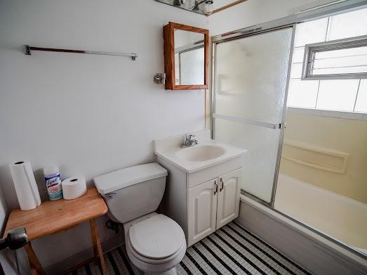 64 Ash St, Park Forest, IL 60466 - full bath with toilet, vanity, and shower / bath combination with glass door