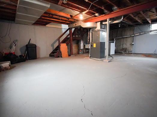 64 Ash St, Park Forest, IL 60466 - unfinished basement featuring stairway and heating unit