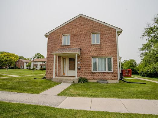 64 Ash St, Park Forest, IL 60466 - view of front of house with a front lawn and brick siding