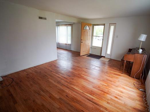 64 Ash St, Park Forest, IL 60466 - entrance foyer with wood finished floors and radiator heating unit