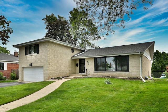 771 S Euclid Ave, Elmhurst, IL 60126 - split level home with brick siding, a garage, and asphalt driveway