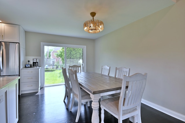 771 S Euclid Ave, Elmhurst, IL 60126 - dining room with a chandelier, dark wood-type flooring, and baseboards