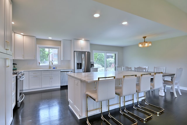 771 S Euclid Ave, Elmhurst, IL 60126 - kitchen featuring stainless steel appliances, plenty of natural light, a sink, white cabinets, and recessed lighting