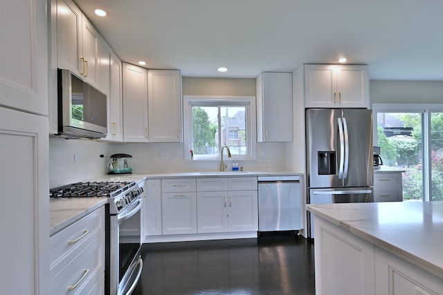 771 S Euclid Ave, Elmhurst, IL 60126 - kitchen with stainless steel appliances, a sink, plenty of natural light, white cabinets, and recessed lighting