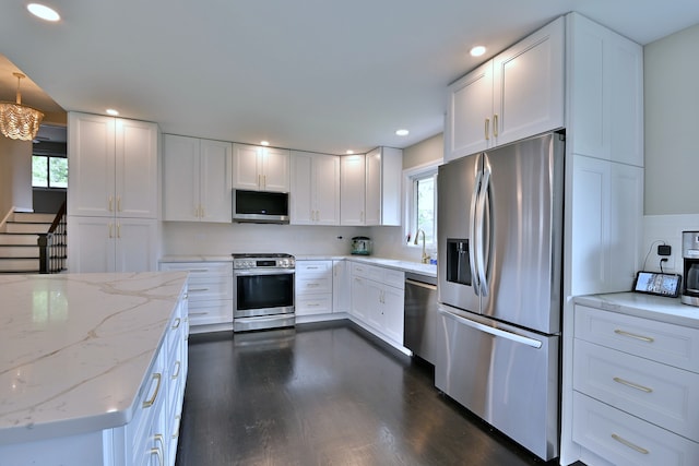 771 S Euclid Ave, Elmhurst, IL 60126 - kitchen with stainless steel appliances, white cabinets, dark wood-style flooring, recessed lighting, and light stone counters