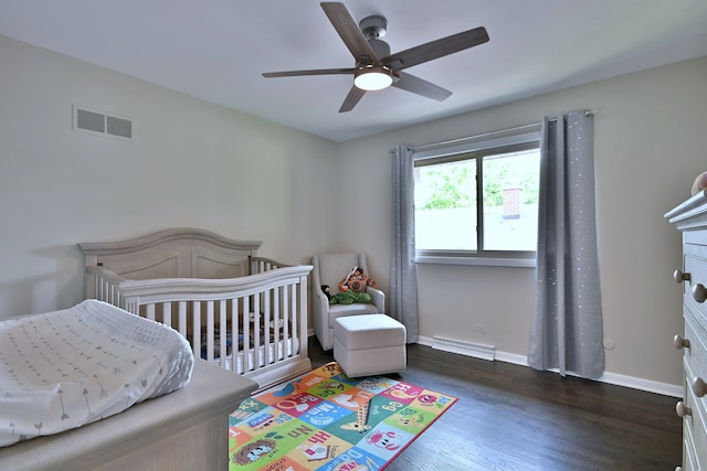 771 S Euclid Ave, Elmhurst, IL 60126 - bedroom with wood finished floors, a crib, baseboards, and ceiling fan