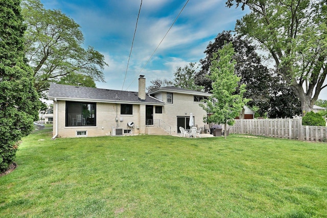 771 S Euclid Ave, Elmhurst, IL 60126 - back of house featuring a chimney, a patio area, brick siding, and central AC unit