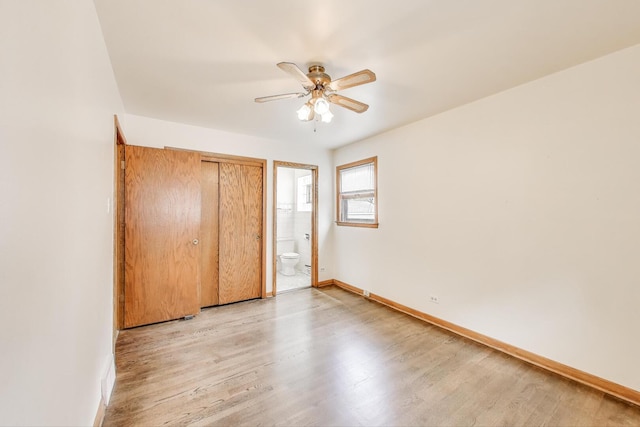 3645 W 66th St, Chicago, IL 60629 - unfurnished bedroom with light wood-style floors, baseboards, connected bathroom, ceiling fan, and a closet