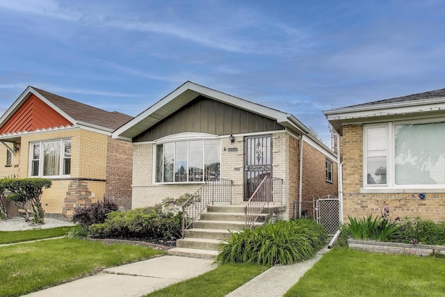 3645 W 66th St, Chicago, IL 60629 - view of front of property featuring brick siding and a front lawn