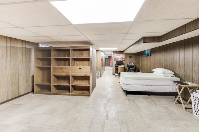3645 W 66th St, Chicago, IL 60629 - bedroom with wooden walls, a paneled ceiling, and baseboards