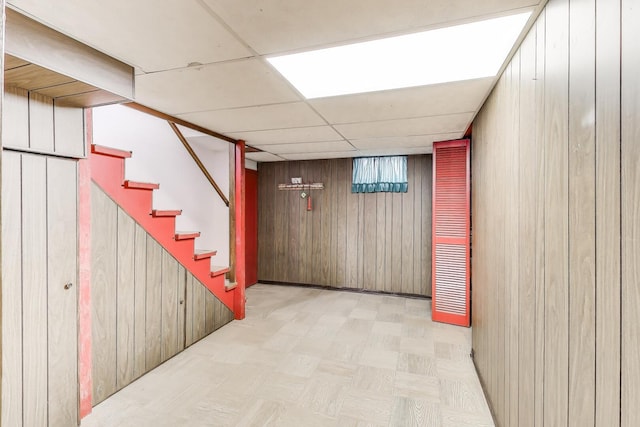 3645 W 66th St, Chicago, IL 60629 - finished basement with wooden walls, light flooring, and stairway