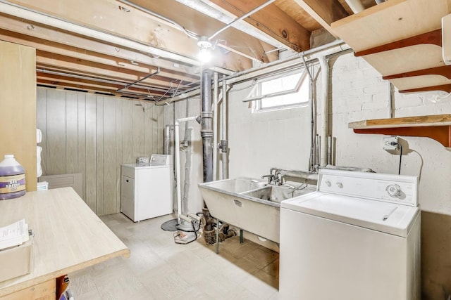 3645 W 66th St, Chicago, IL 60629 - laundry area with separate washer and dryer, light floors, and wooden walls