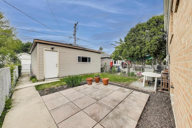 3645 W 66th St, Chicago, IL 60629 - fenced backyard with a patio and an outbuilding