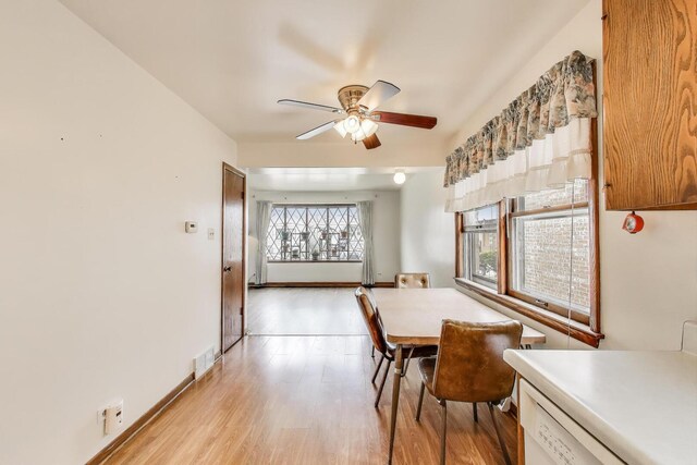 3645 W 66th St, Chicago, IL 60629 - dining room with a ceiling fan and light wood-type flooring