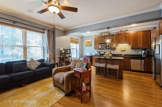 1849 W Newport Ave Unit 1, Chicago, IL 60657 - living area with light wood-type flooring, a ceiling fan, and ornamental molding