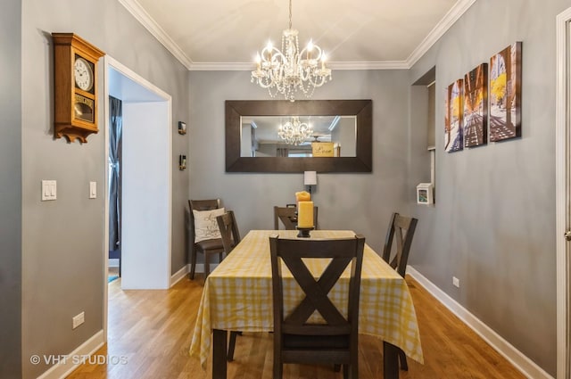 1849 W Newport Ave Unit 1, Chicago, IL 60657 - dining space with a chandelier, wood finished floors, and crown molding